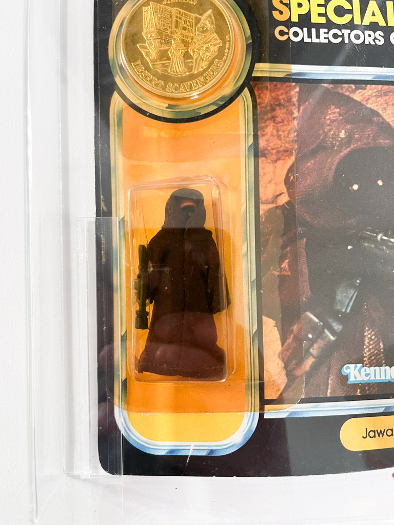 Star Wars action figure in packaging with gold coin and collectible card