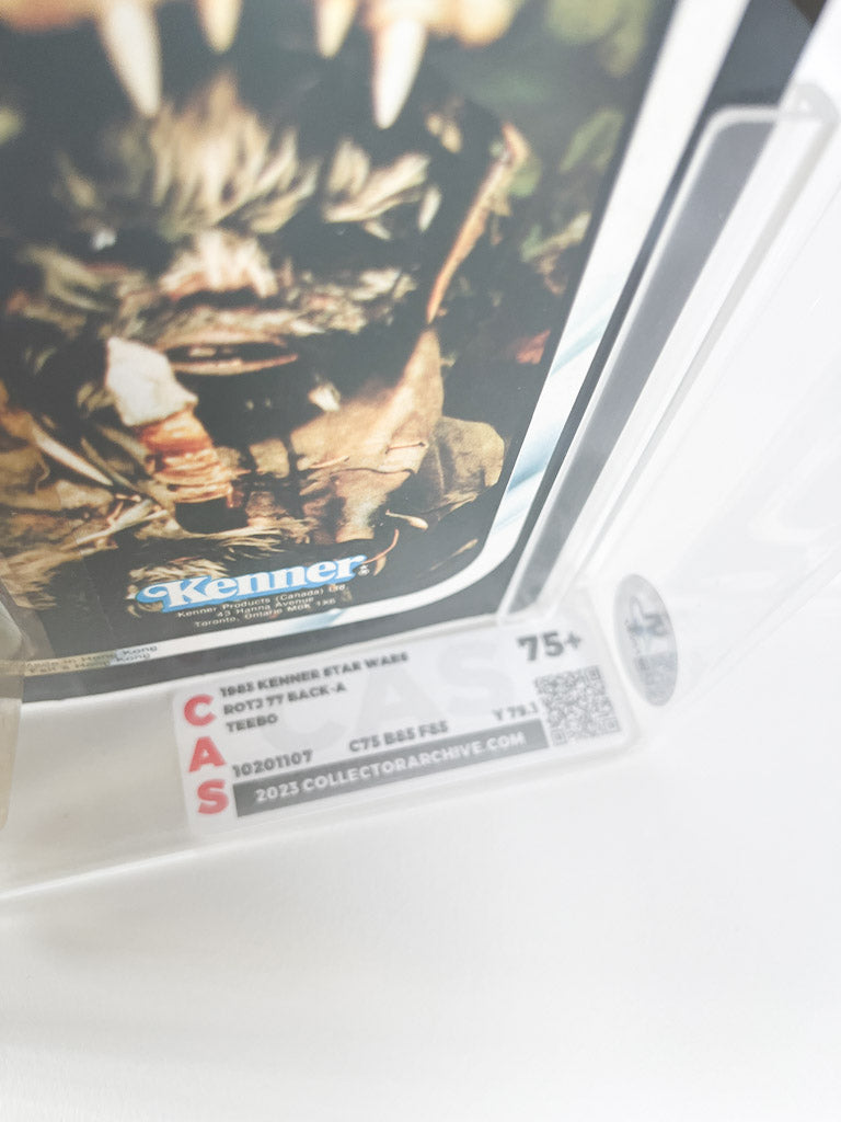Action figure from 'Star Wars' in a protective case. 75+ CAS rating sticker